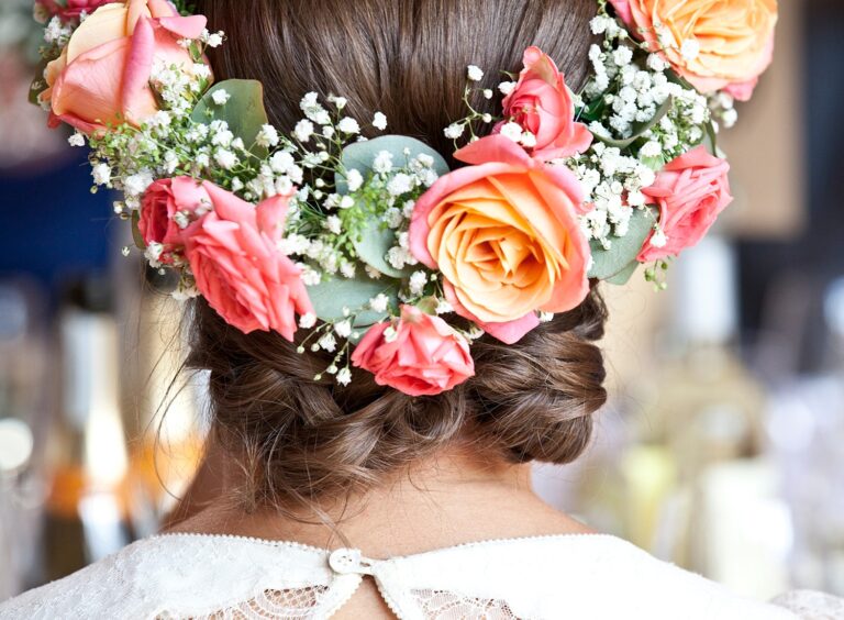 A bride's flower crown of roses and gypsophila, from behind, Paola De Paola Photography