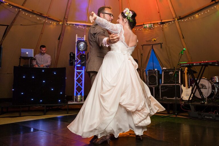 A first dance in the tipi at a festival-style wedding in Wales, Paola De Paola Photography
