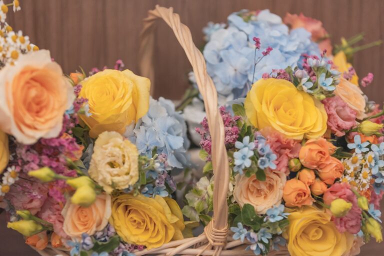 Baskets of yellow and peach roses with blue hydrangea, Leslie and Marco's wedding, Capotaormina, Paola Lapi Luxury Event