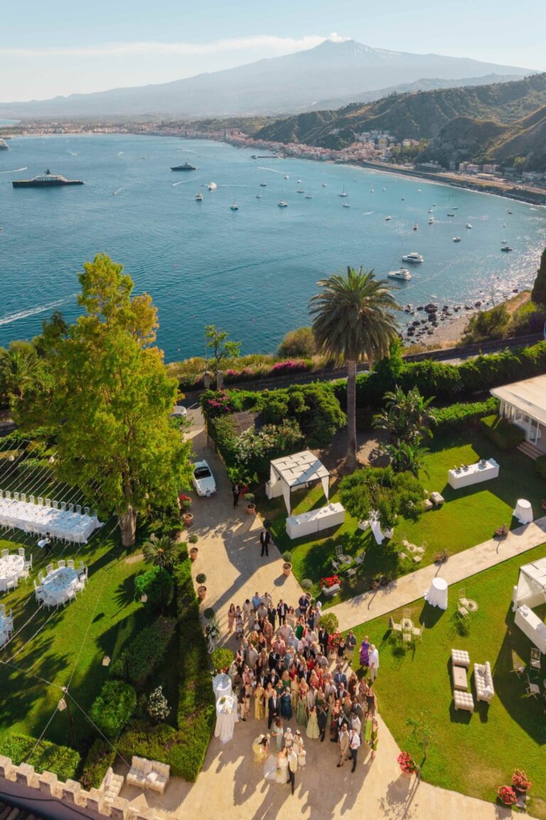 Aerial view of guests on the villa terrace, the bay and Etna behind, Villa Mon Repos, Taormina, Paola Lapi Luxury Event