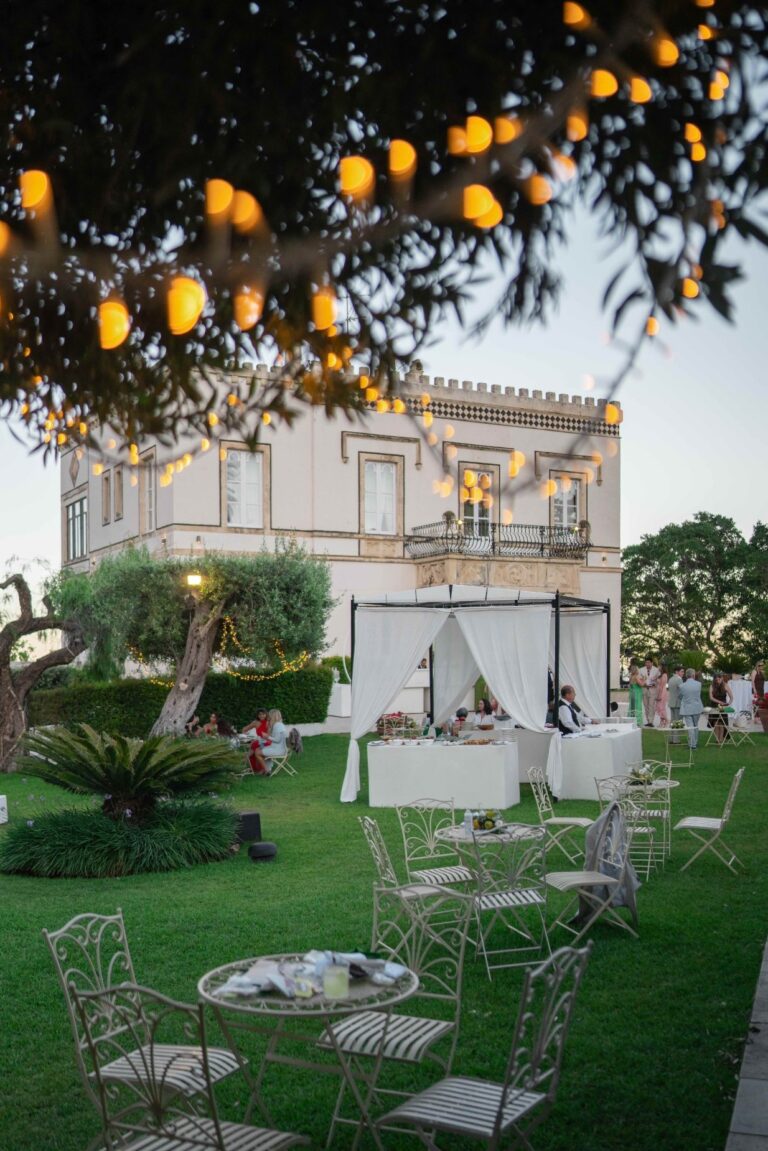 The villa at dusk with lights strung through an olive tree over the welcome area, Villa Mon Repos, Taormina, Paola Lapi Luxury Event