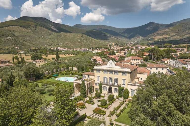 The house from the air, clock tower and pool, the valley and the hills behind it, Paolo Cicognani Weddings & Events