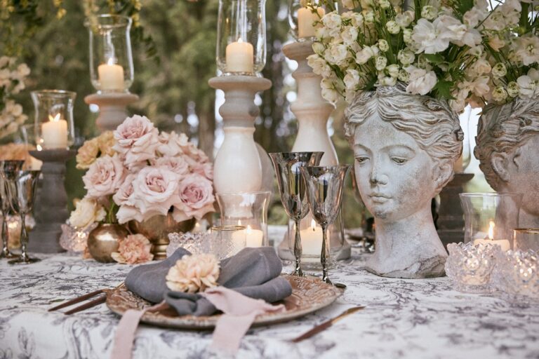 Classical bust planters, garden roses and candlelight, on a toile cloth under the trees, Paolo Cicognani Weddings & Events