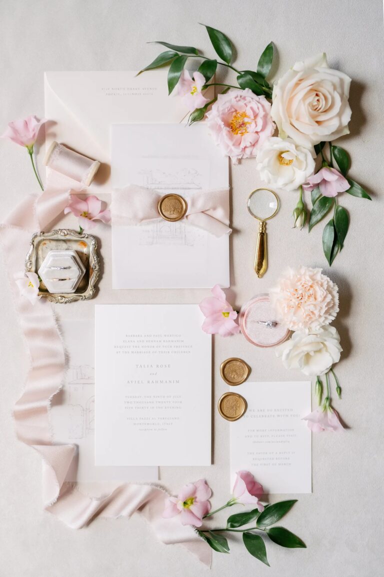 Talia and Aviel's suite in blush and gold: ribbon, wax seals, and a brass magnifying glass, Paolo Cicognani Weddings & Events