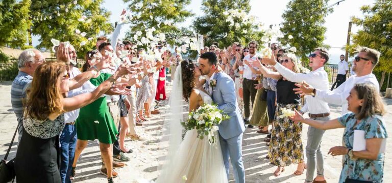 Guests throwing confetti as the couple kiss, Liopetro, Paphos Weddings Made Easy