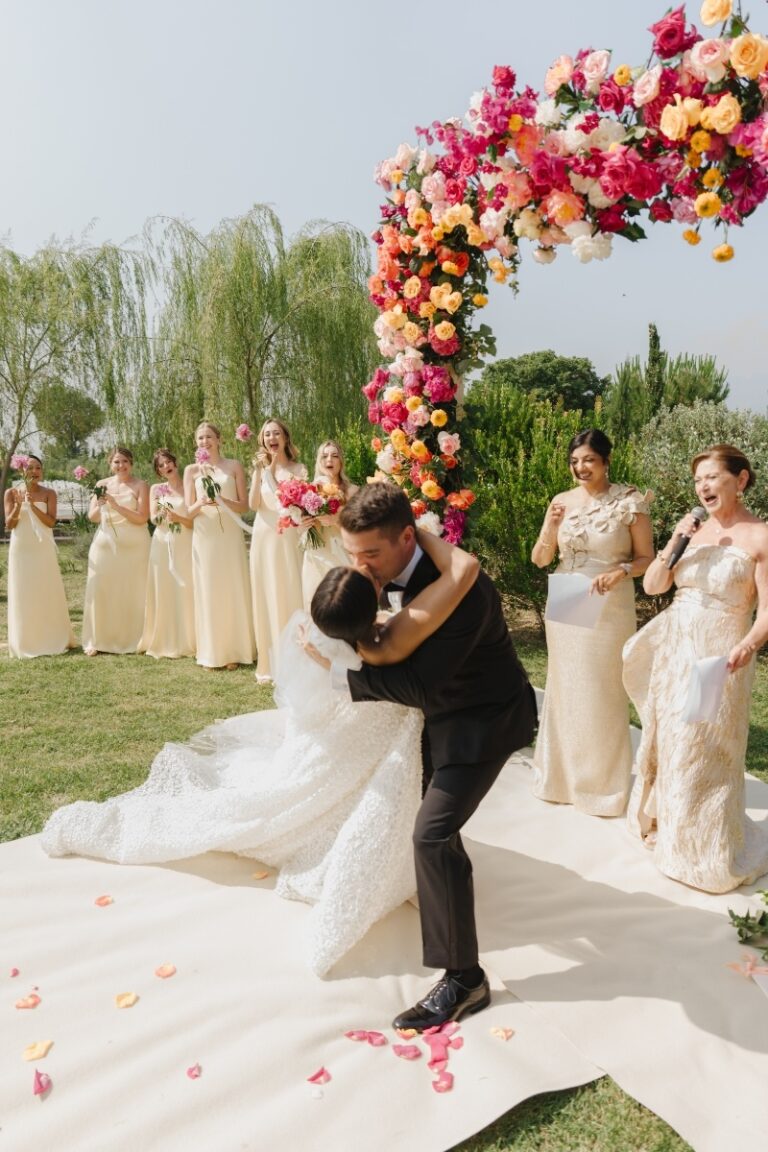 First Kiss at the Floral Arch with Bridesmaids, Paradis Pietrasanta