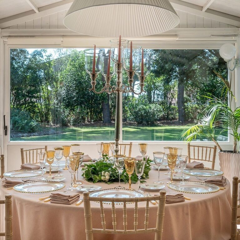 A round table in the banquet hall looking onto the park, Parco dei Cavalieri