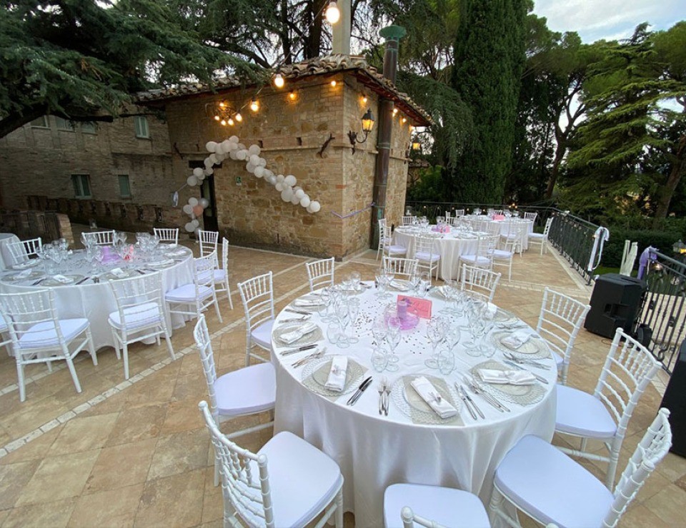 Tables laid under the garden pergola, Parco dei Cavalieri