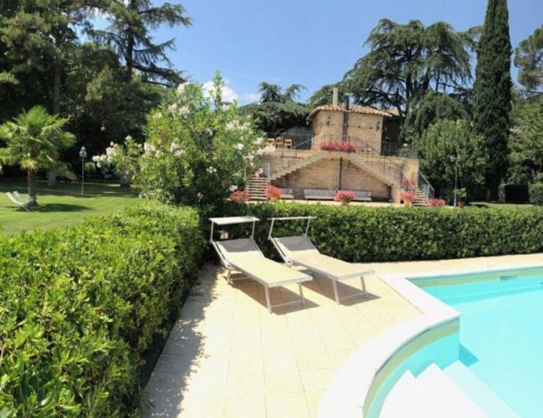 The garden swimming pool with the villa behind, Parco dei Cavalieri