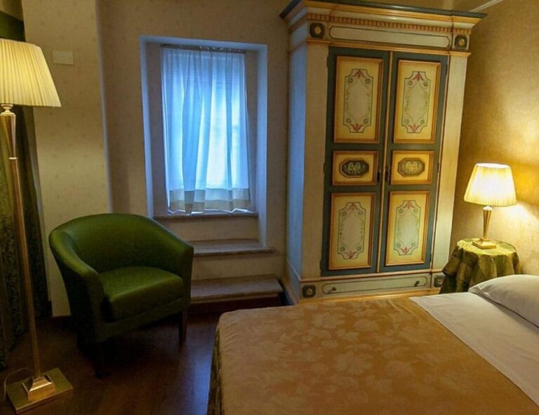 A bedroom with a painted wardrobe, Parco dei Cavalieri