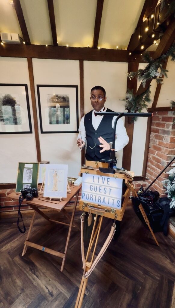 A live guest portraits station with an easel and table, Patrick Heisel Watercolours