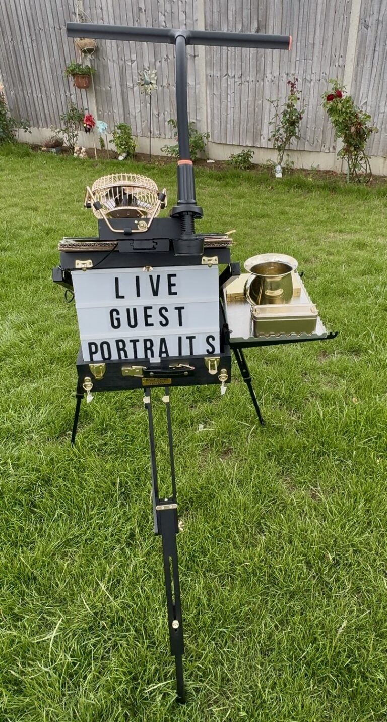 A live guest portraits sign on an easel in a garden, Patrick Heisel Watercolours