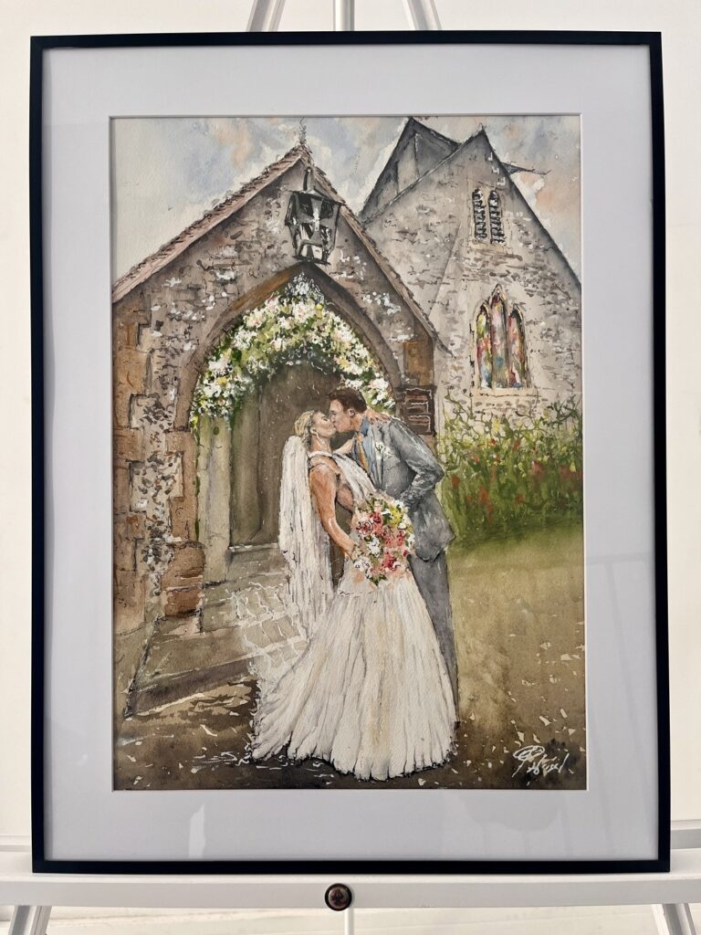 Framed watercolour of a bride and groom kissing at a church door, Patrick Heisel Watercolours