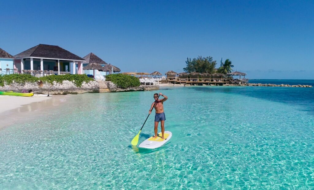 Paddleboarding in the shallow water, Pearl Island Bahamas