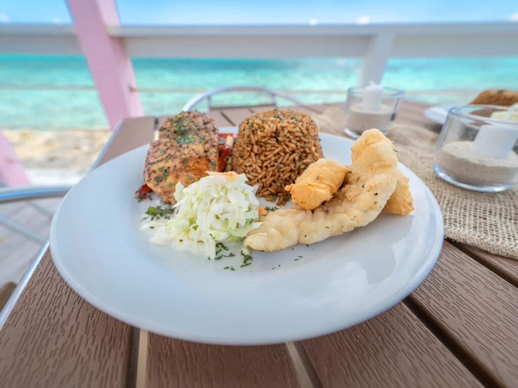 Bahamian lunch of grouper with peas and rice, ocean view, Pearl Island Bahamas