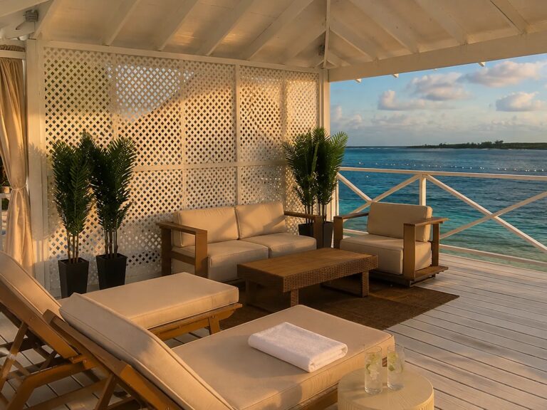 Cabana lounge seating with an ocean view at sunset, Pearl Island Bahamas