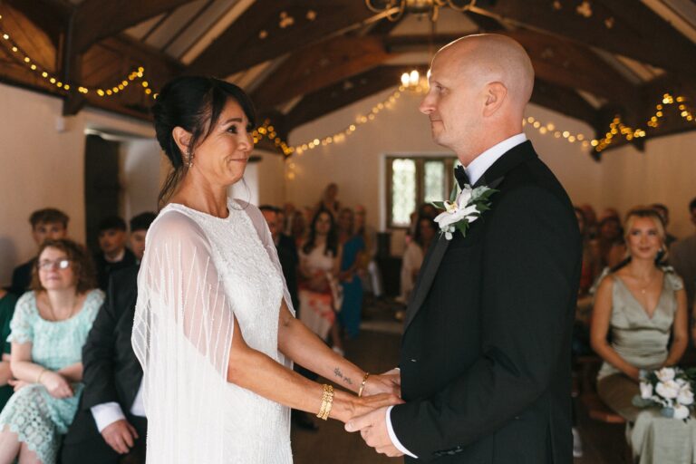 An indoor ceremony beneath fairy lights, Pentillie Castle