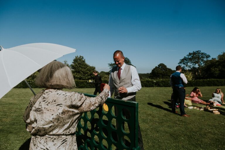 Champagne on the lawn during the reception, Pentillie Castle
