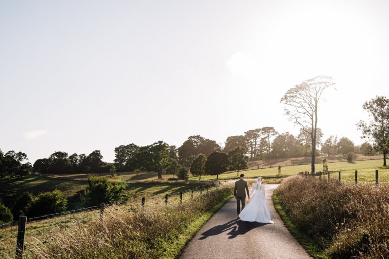 A couple on a country lane at golden hour, Pentillie Castle