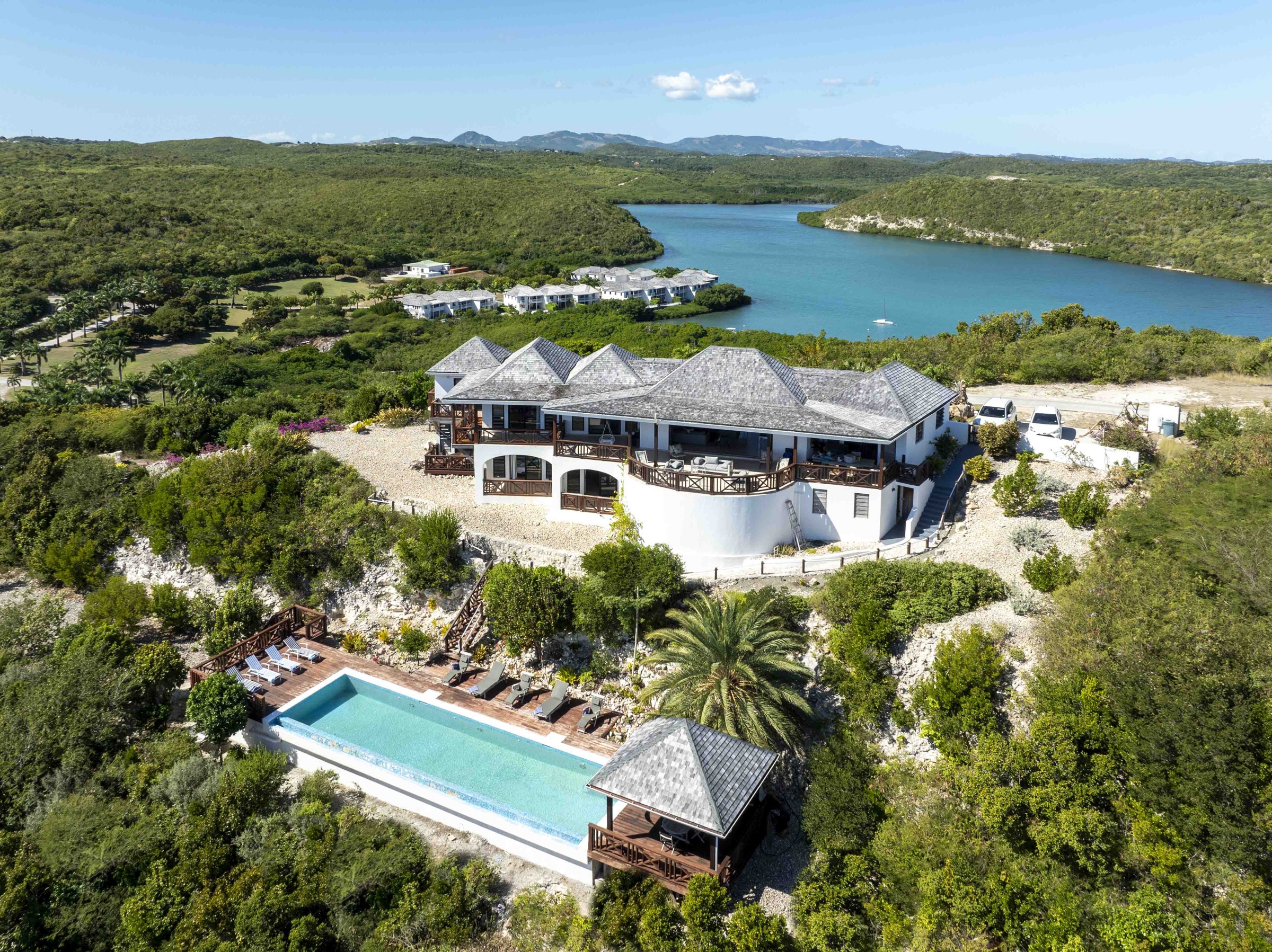 Aerial view of the villa and pool with the bay and inlet behind, Perfect Sunshine Antigua