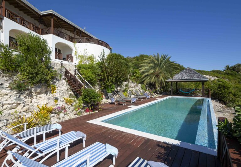 The pool deck with striped loungers beside the villa, Perfect Sunshine Antigua