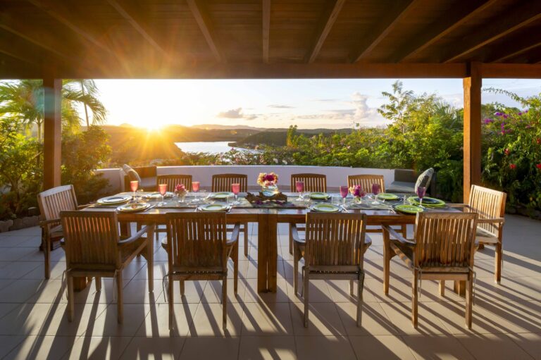 The veranda dining table at sunset, Perfect Sunshine Antigua
