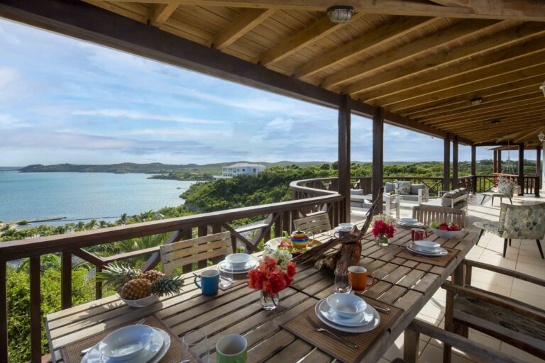 Breakfast table laid on the veranda above the bay, Perfect Sunshine Antigua