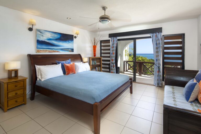 Bedroom with a king bed and balcony doors to the sea, Perfect Sunshine Antigua