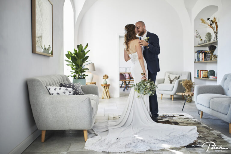 Couple embracing in a bright, airy interior, Petr Pelucha Photography