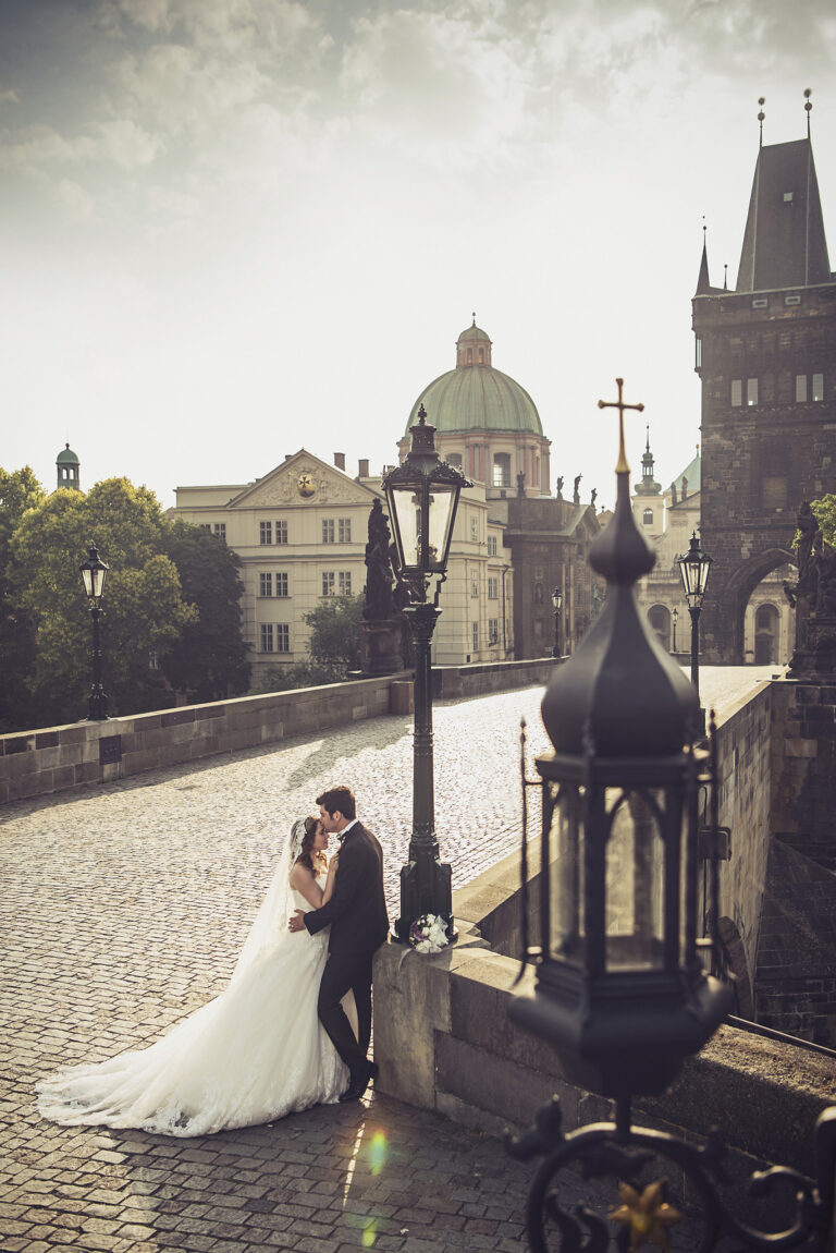 Couple on Charles Bridge in early light, Prague, Petr Pelucha Photography
