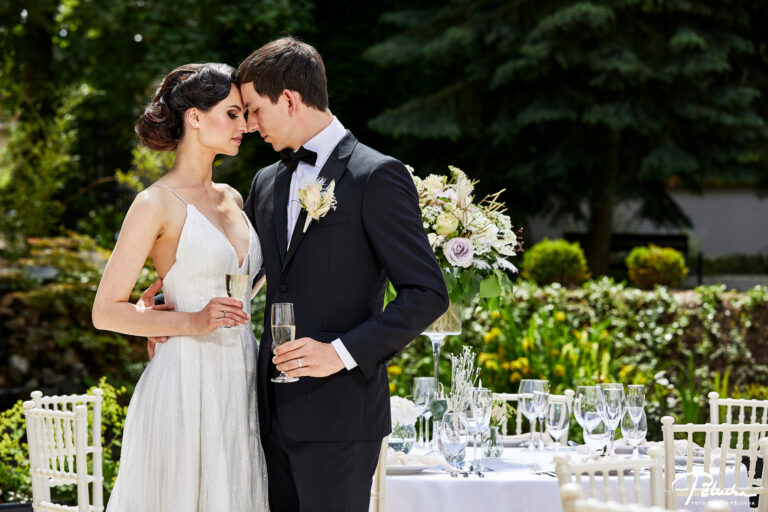 Couple at a styled dining table in a garden, Petr Pelucha Photography