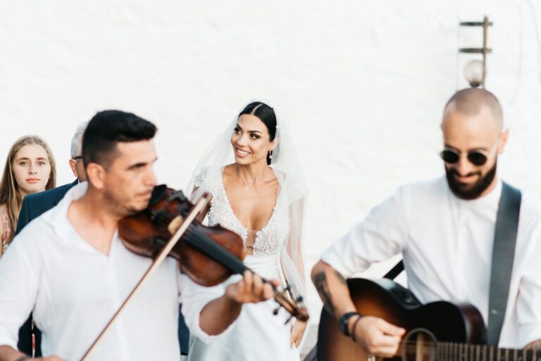 A violinist and guitarist play beside the bride, Photomad
