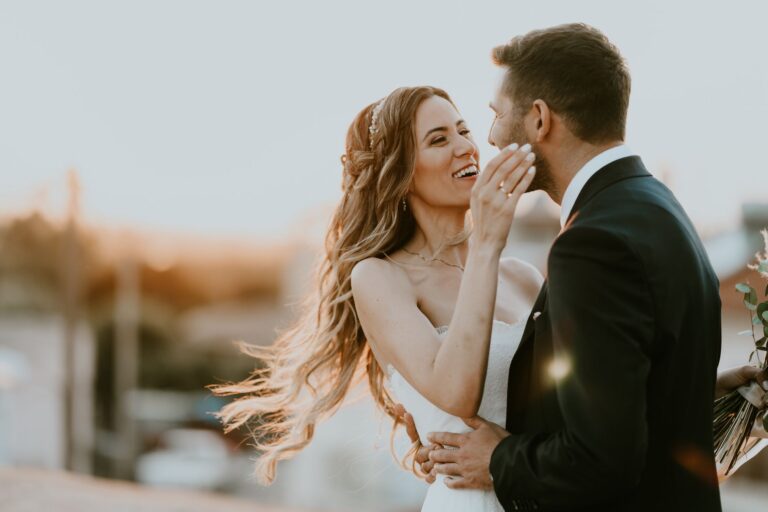 A couple embrace in golden evening light, Photomad