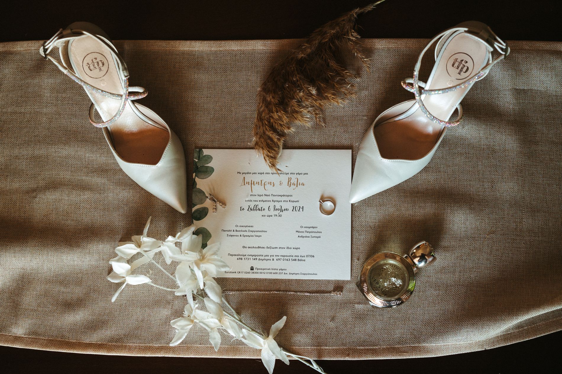 Bridal shoes, invitation and details laid out before the wedding, Photomad