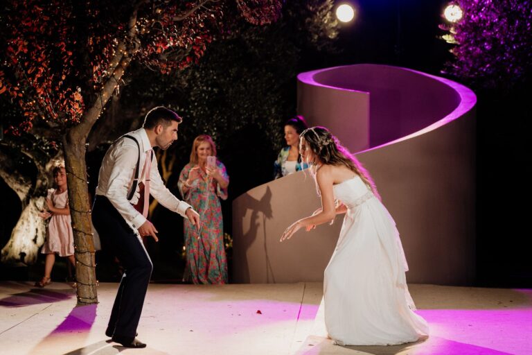 The bride dances on a lit floor under trees at the reception, Photomad
