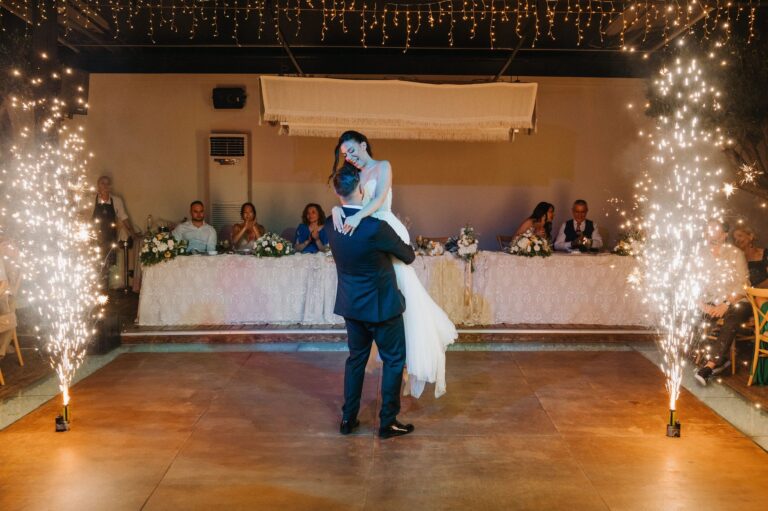The first dance lit by sparkler fountains in front of the top table, Photomad