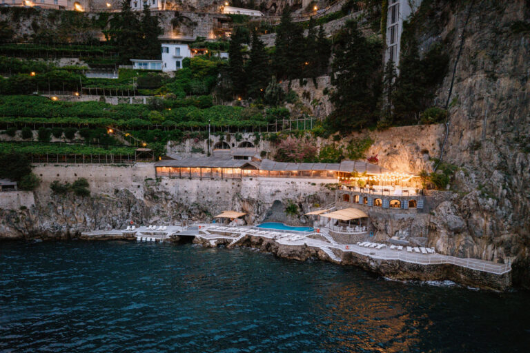 Hotel Santa Caterina on the cliffs at dusk, seen from the air, Amalfi, Pierpaolo Perri