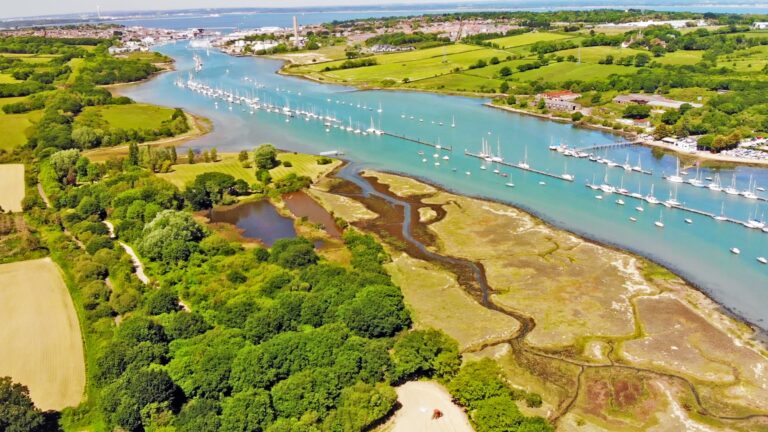The Medina valley looking north towards Cowes and the Solent, with saltmarsh, woodland and the river moorings, Pinkmead Estate