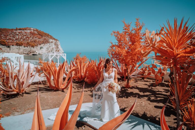 Chromatic infrared turns the agaves rust red around a bride above the sea, Mattinata, Pino Coduti Photography