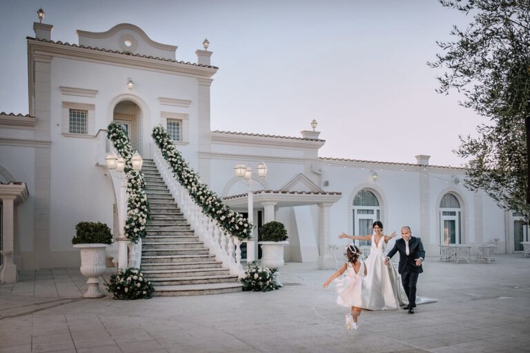 The couple on the white courtyard at Tenimento San Giuseppe, a restored masseria near Foggia, Pino Coduti Photography