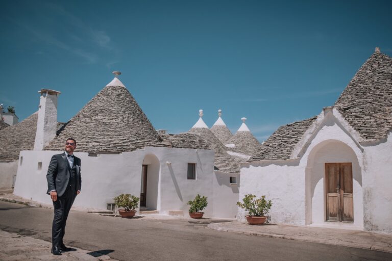 A groom waiting among the trulli of Alberobello, Pino Coduti Photography