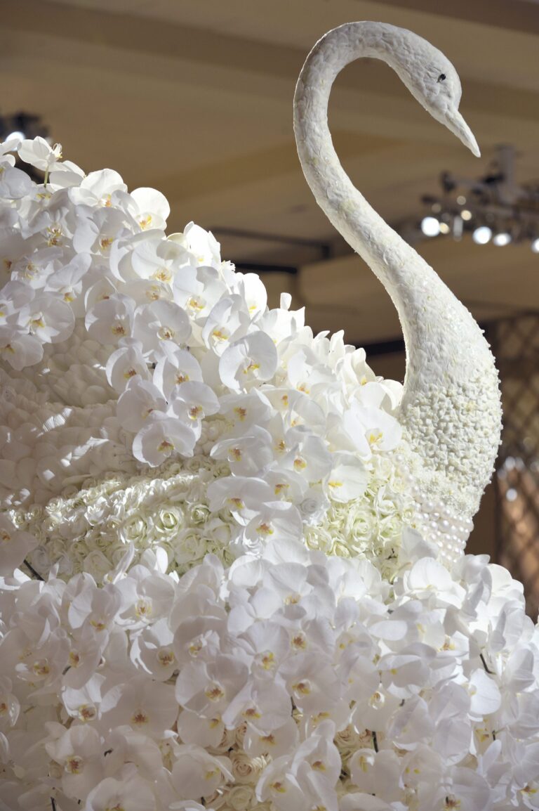 A sculpted swan covered in white orchid petals, Preston Bailey