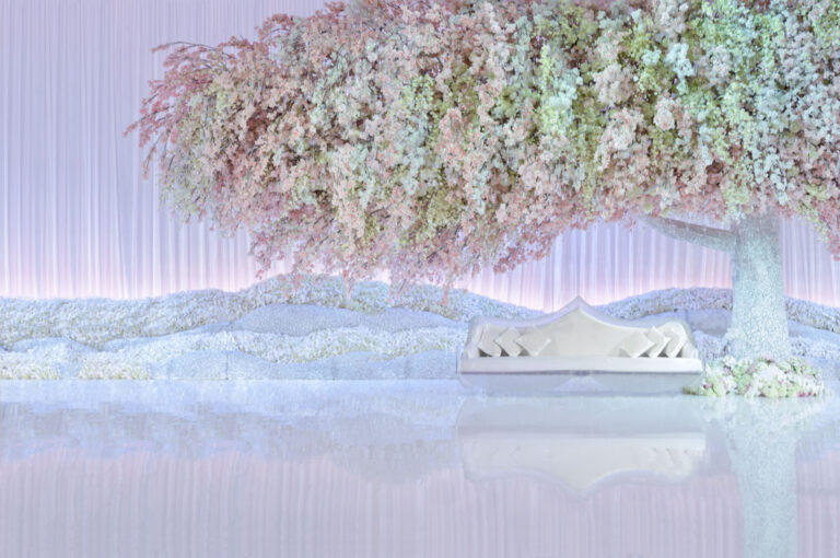 A stage set with a pink and white blossoming tree over a white floor, Preston Bailey