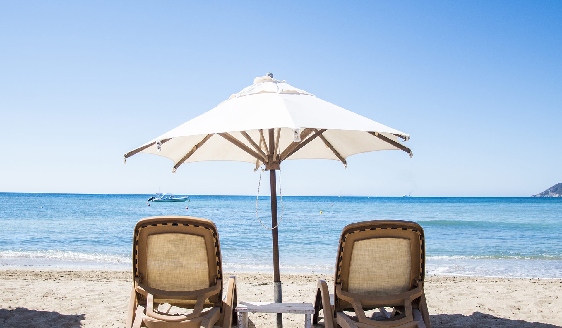 Sunbeds on the sand at Pura Vida, Pura Vida Beach Ibiza