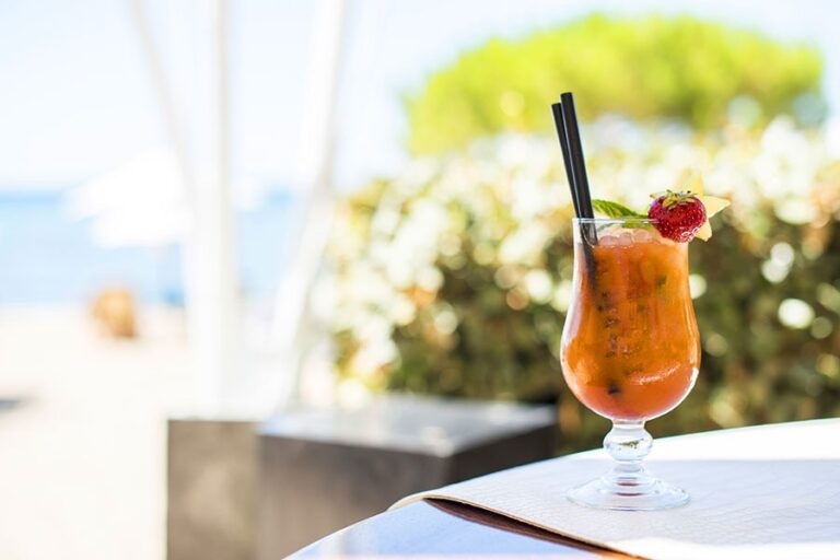 A cocktail on the beach, over the sea, Pura Vida Beach Ibiza