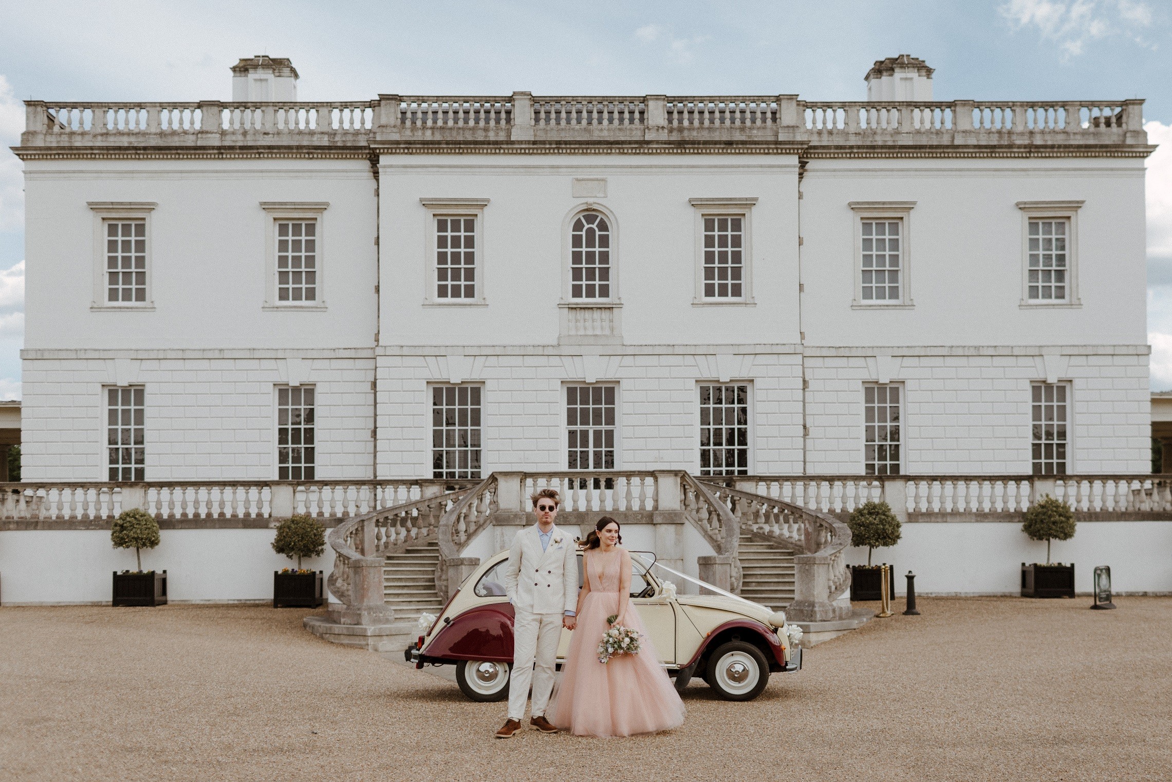 A couple and a vintage car in front of the Queen's House, Queen's House