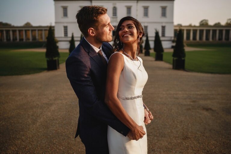 A couple embracing with the Queen's House behind, Queen's House