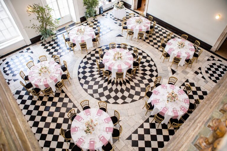 Round tables on the black and white marble floor of the Great Hall, Queen's House