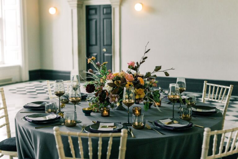 A round table laid with dark linen, Queen's House