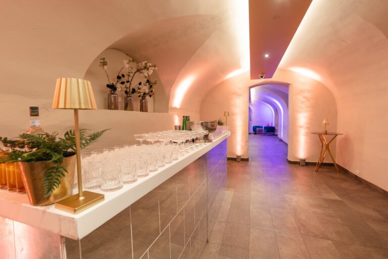 A vaulted chamber of the Undercroft lit for a reception, Queen's House